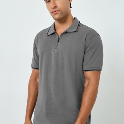 Classic grey piqué polo shirt tailored in a relaxed fit for all-day comfort. Featuring a modern zip