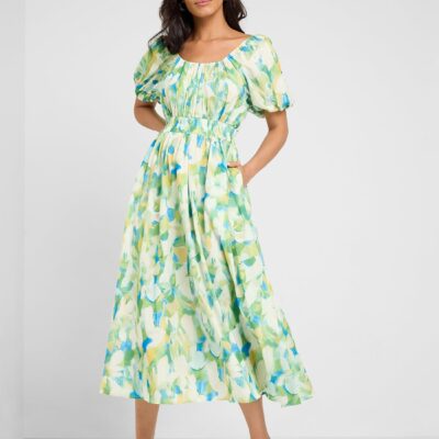 This charming midi dress features a colorful floral print in shades of green, yellow and blue, with